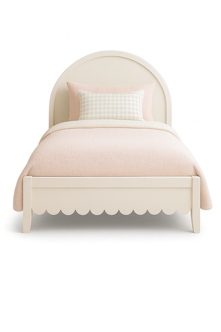 The Fleur Bed front view – children’s bed with arched headboard and scalloped footend, styled with blush bedding and handcrafted by Baby Belle Kids Furniture