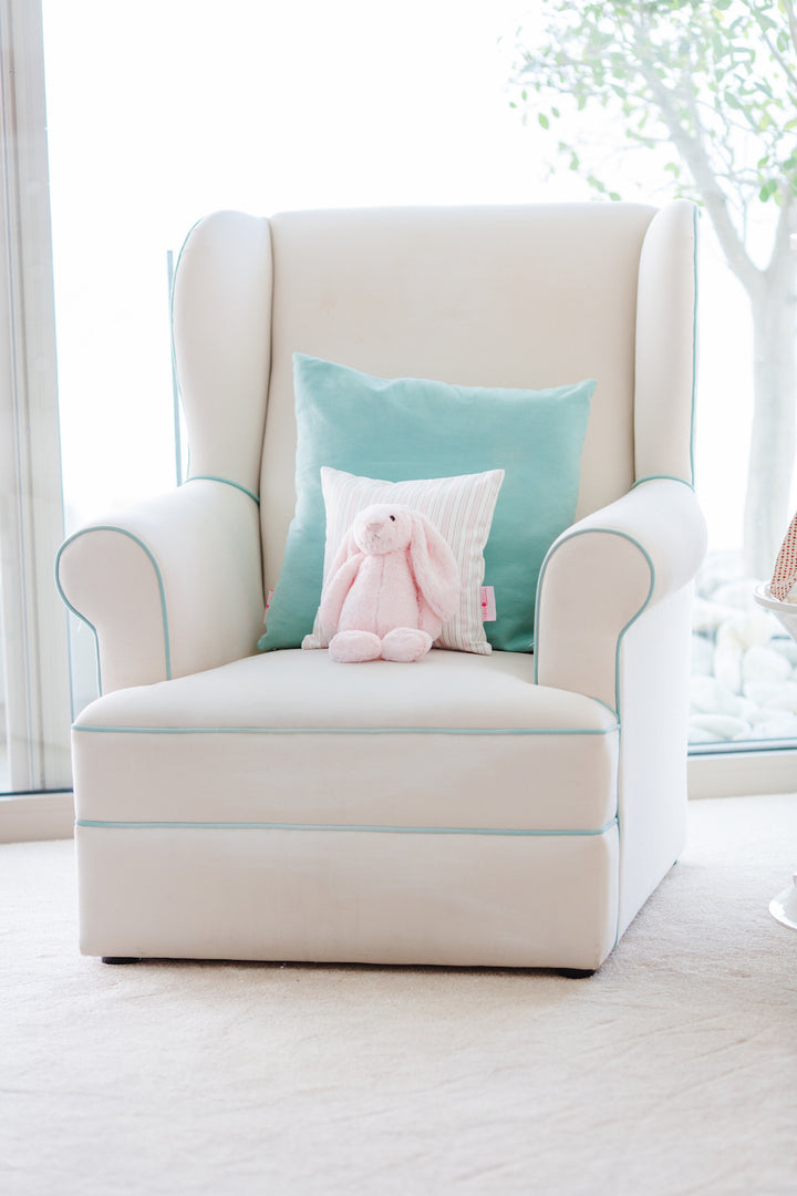 Baby Belle Entree Feeding Chair in cream fabric with aqua piping, classic wingback design, wide seat, and optional glider base – handcrafted luxury nursing and feeding chair South Africa