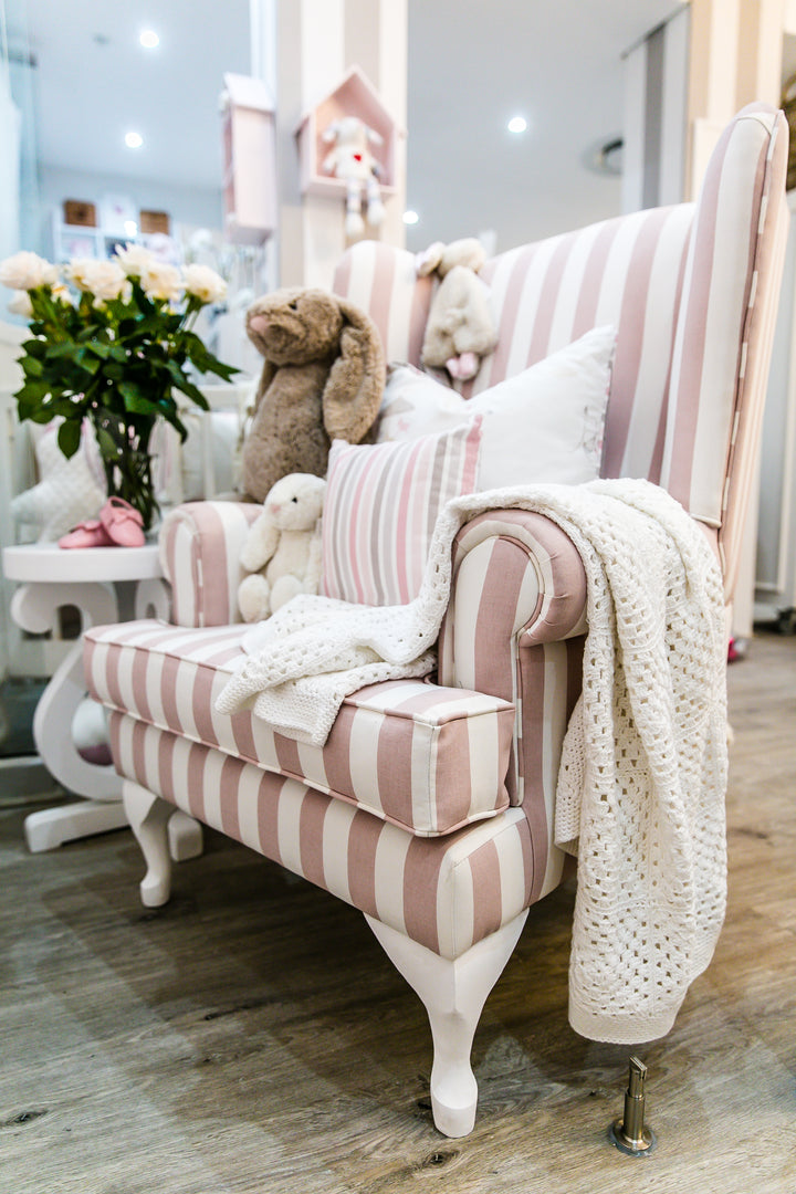 Baby Belle Oliver Feeding Chair in pink and white stripe fabric with classic wingback design and Queen Anne legs, luxury nursing and feeding chair handcrafted in South Africa.
