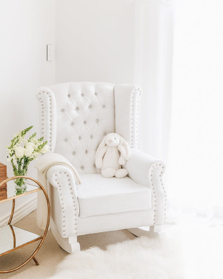 Luxury Ava Rocking Chair in white with tufted wingback, stud detailing, and plush cushioning – styled in Jenna McArthur’s nursery by Baby Belle South Africa