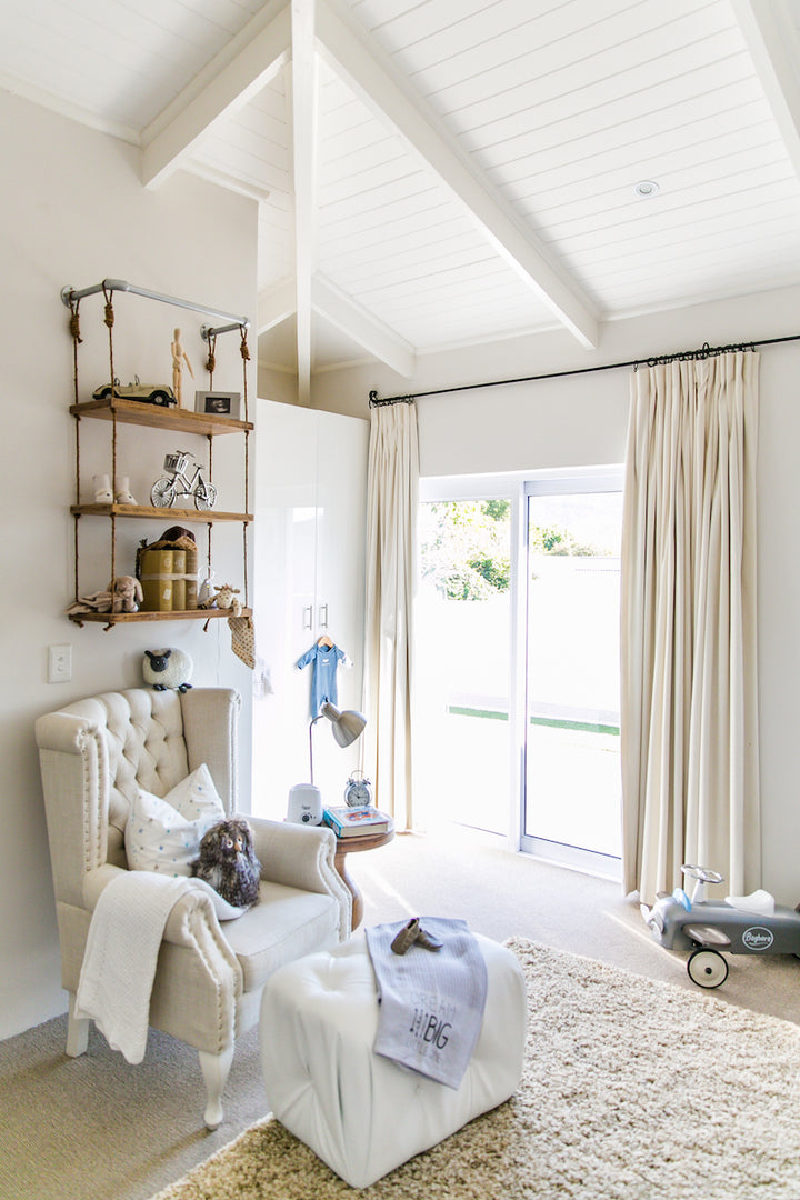 Sebastian Feeding Chair styled in the elegant nursery of Baby Belle founder Pascale Cilliers, featuring a classic wingback design with buttoned backrest, studded detailing, and Queen Anne legs.